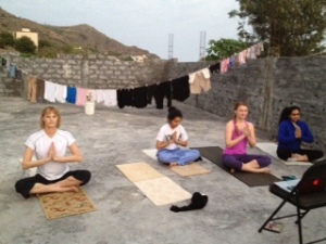 Namaste! A great start to the day - practicing some yoga in the kintal.